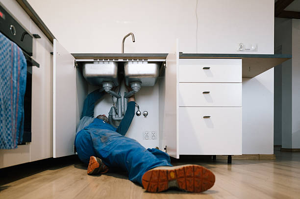Professional Plumbing technician working in Mc Louth, KS
